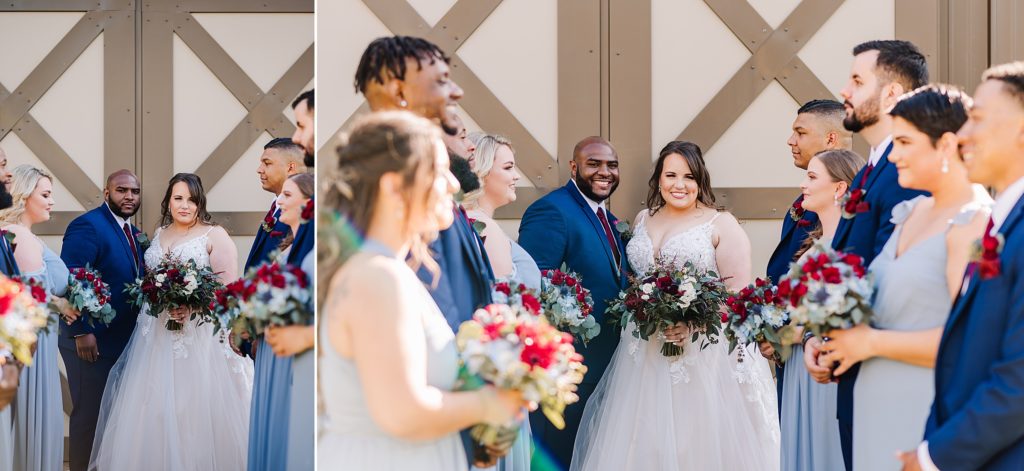 bride and groom smiling at camera surrounded by wedding party