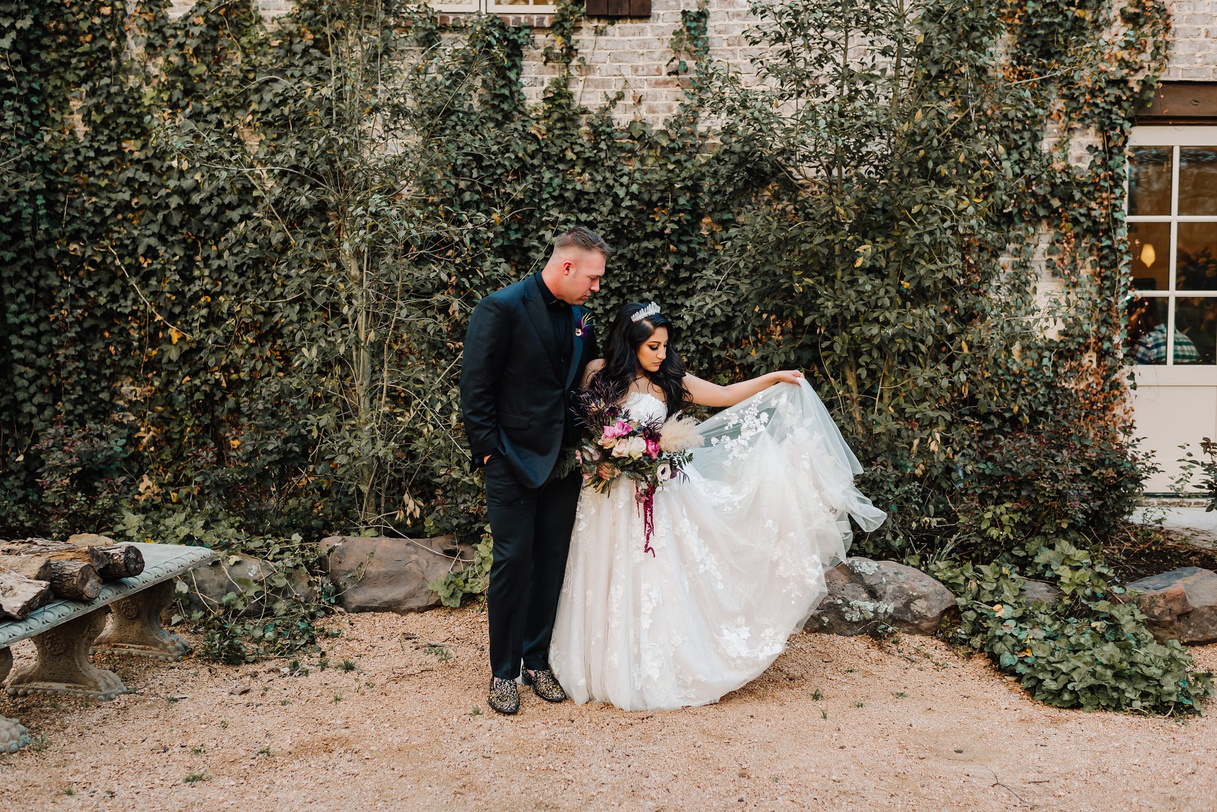 bride and groom outdoor portrait by ivy wall