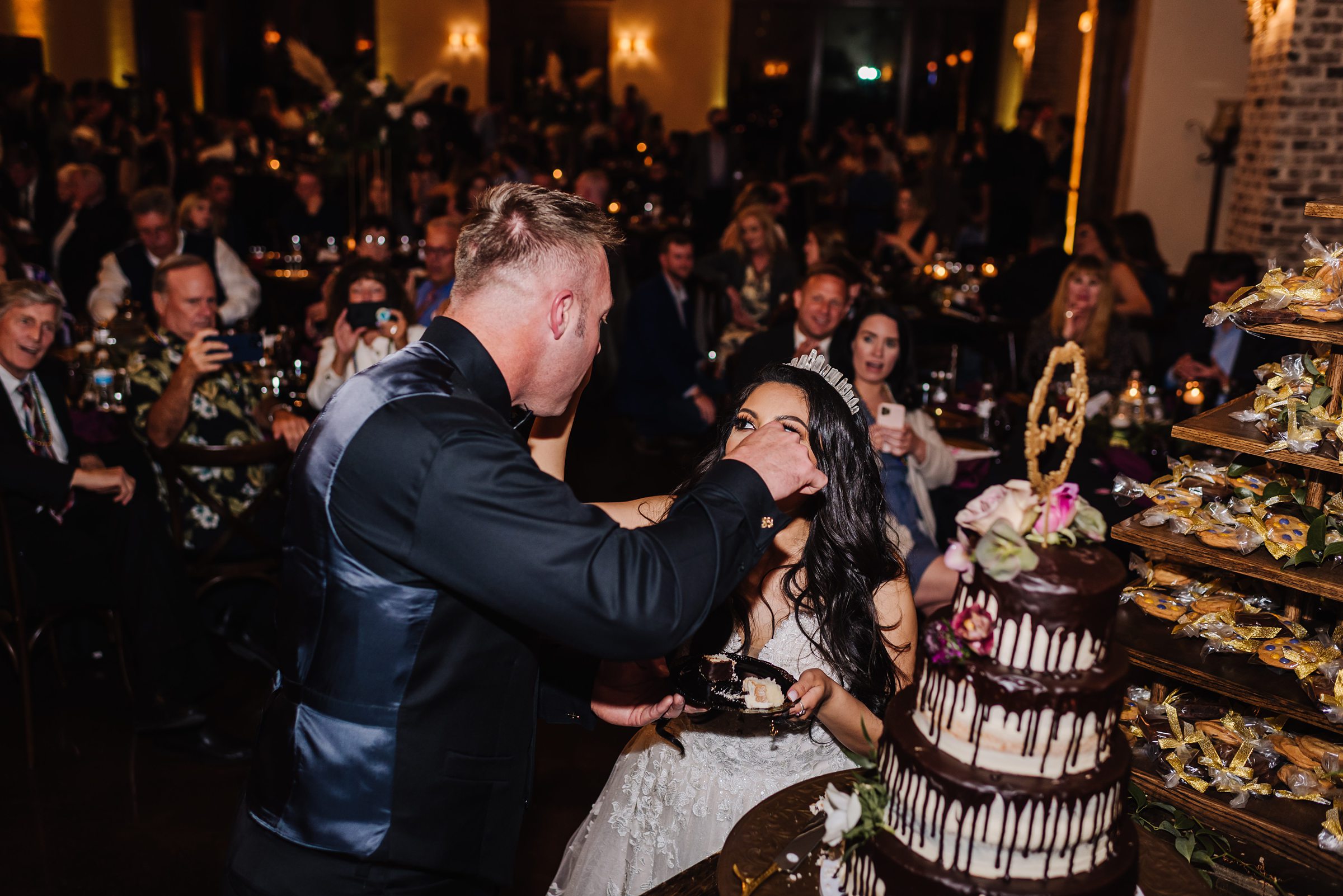 bride and groom cutting wedding cake