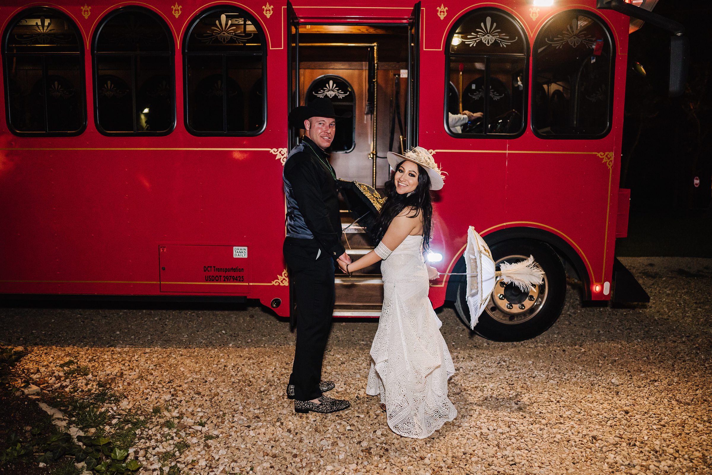 bride and groom with getaway trolly