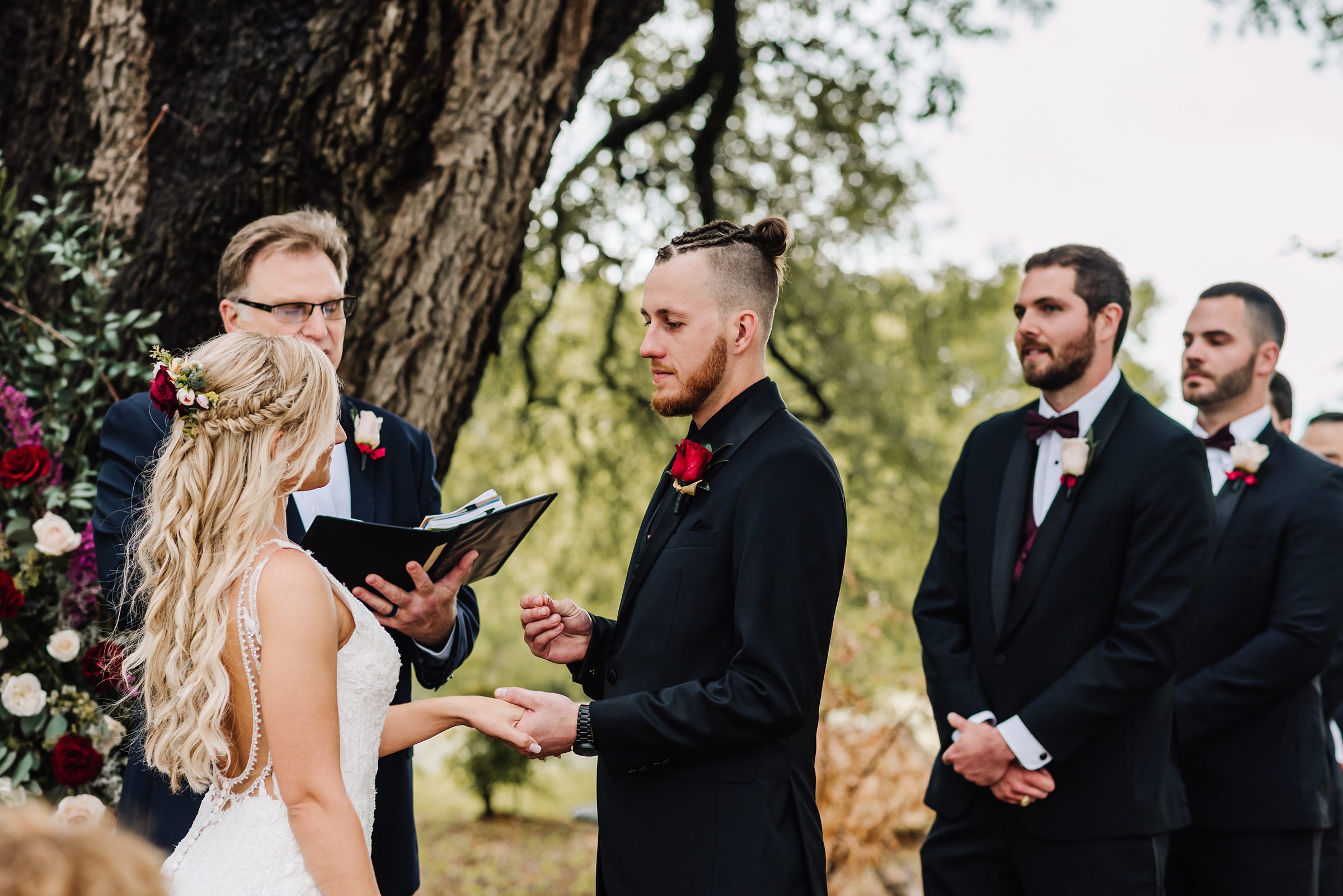 groom saying vows during wedding ceremony