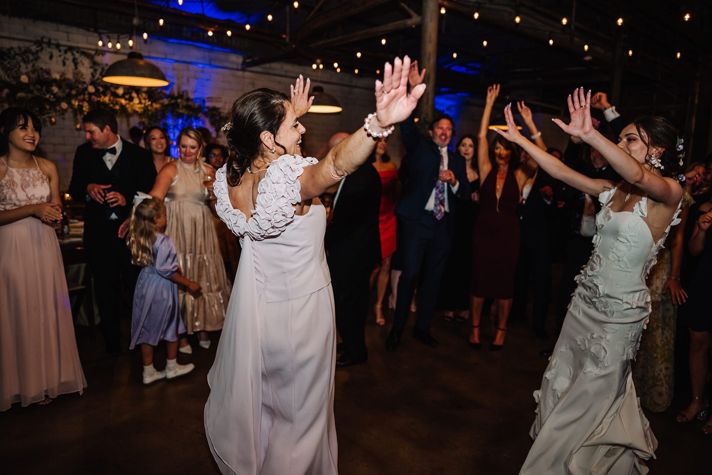 bride dancing with mom at wedding reception