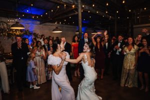 bride dancing with mom at wedding reception