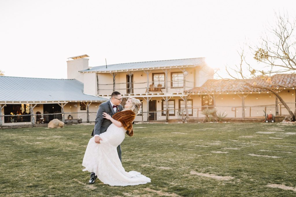 bride and groom dancing in courtyard at rest yourself ranch