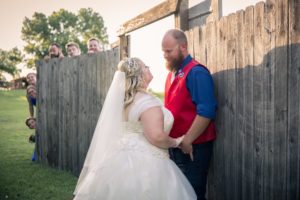 wedding party peeking at the newlywed