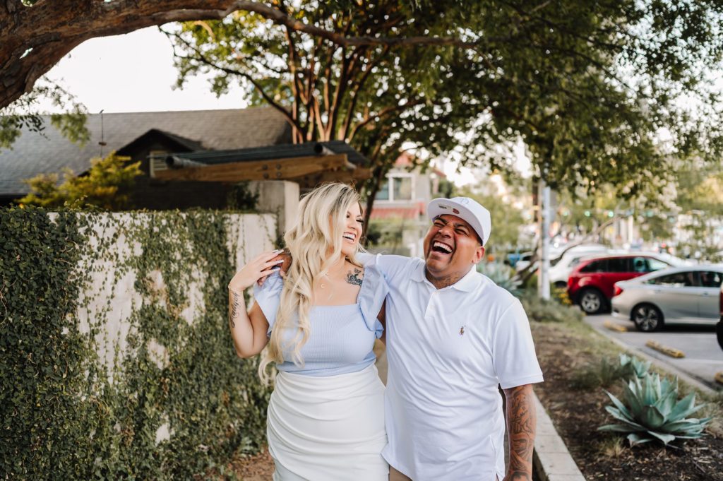 couple laughing during south congress downtown Austin engagement session