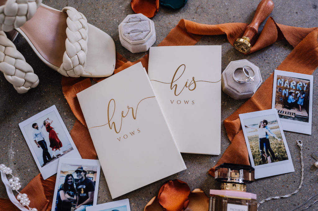 wedding vow books with polaroids and terracotta ribbon