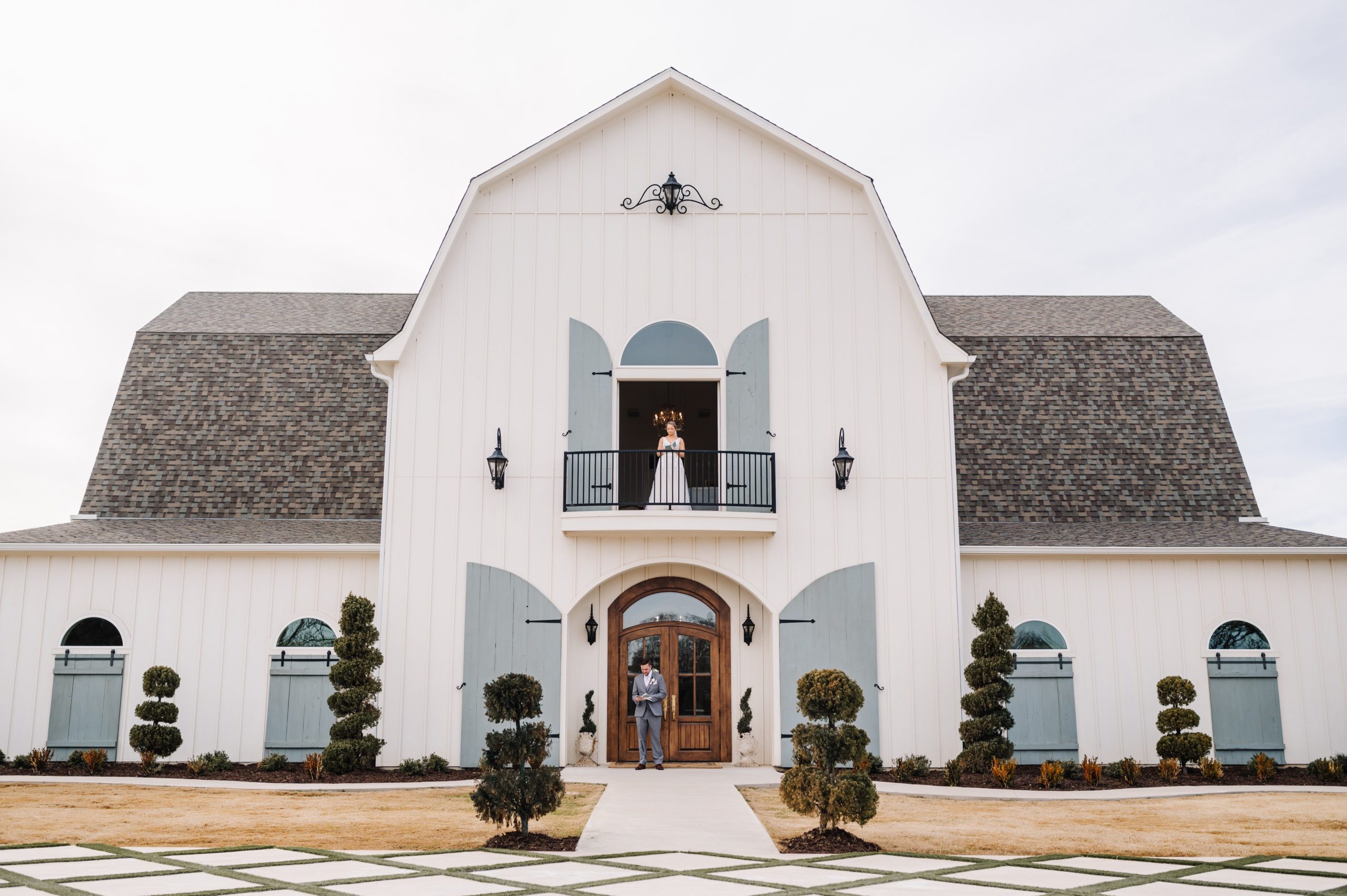bride and groom preparing for their wedding at the French farmhouse venue in Collinsville, Texas