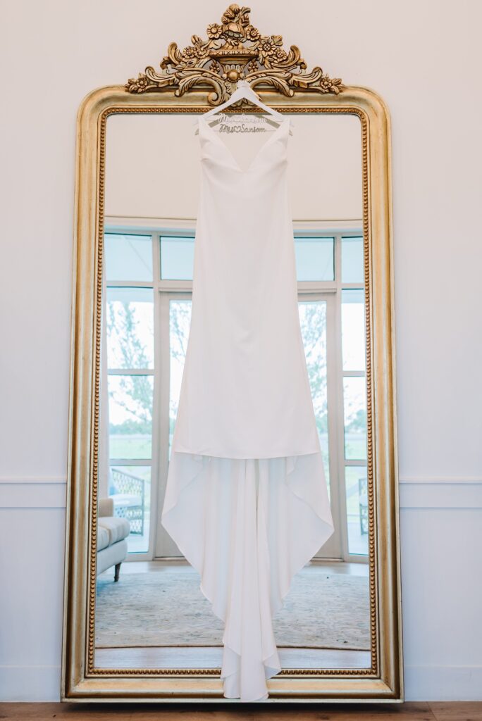 wedding dress hanging in the bridal suite at the gardenia venue