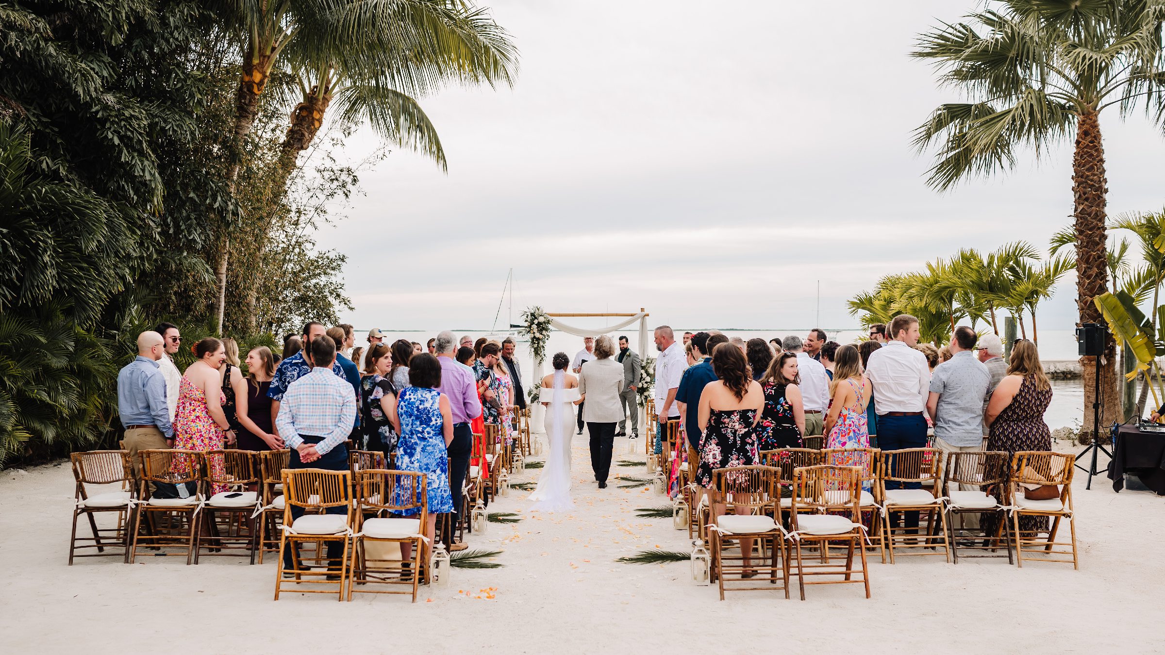 Sunset vows at a beach wedding ceremony in Key Largo, Florida.